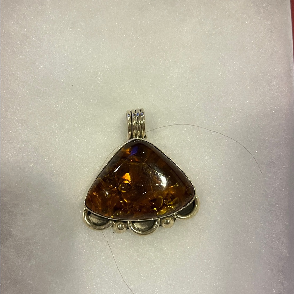 Triangular Amber Pendant With Silver Detailing - image 1